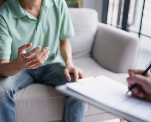 Man talking to counselor during therapy session
